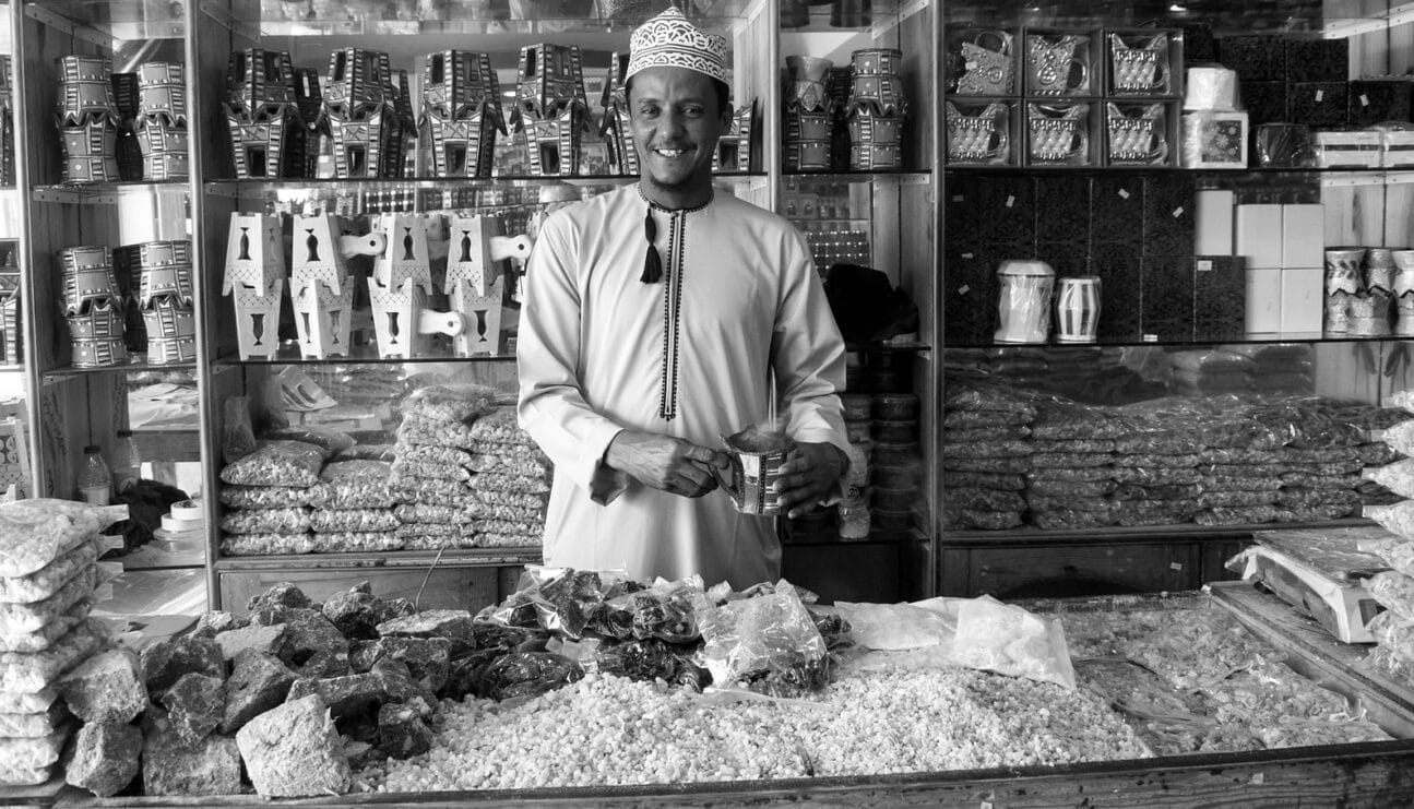 Oman, Salalah, Souq, Frankincense seller with censer.