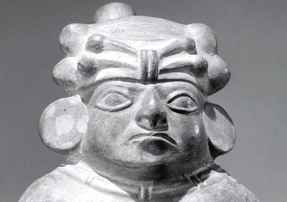 Vessel, Dignitary appear with a dilated cheek by the bola or acullico. He is keeping a saliva-soaked ball of coca leaves in the mouth. Peru, Moche (MET, 1979.206.1113)