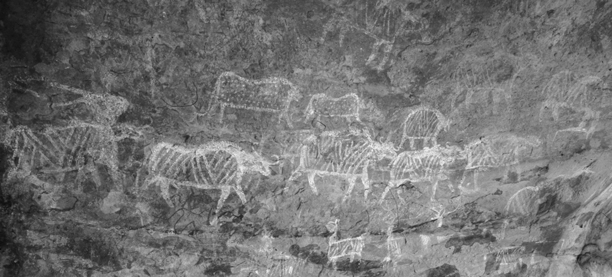 Lions with a dotted body on top of a herd of cattle The Rock Art Site of Karabad Lions with a dotted body on top of a herd of cattle The Rock Art Site of Karabad