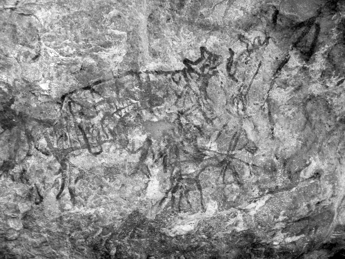 Big cat, small humans and other figures.