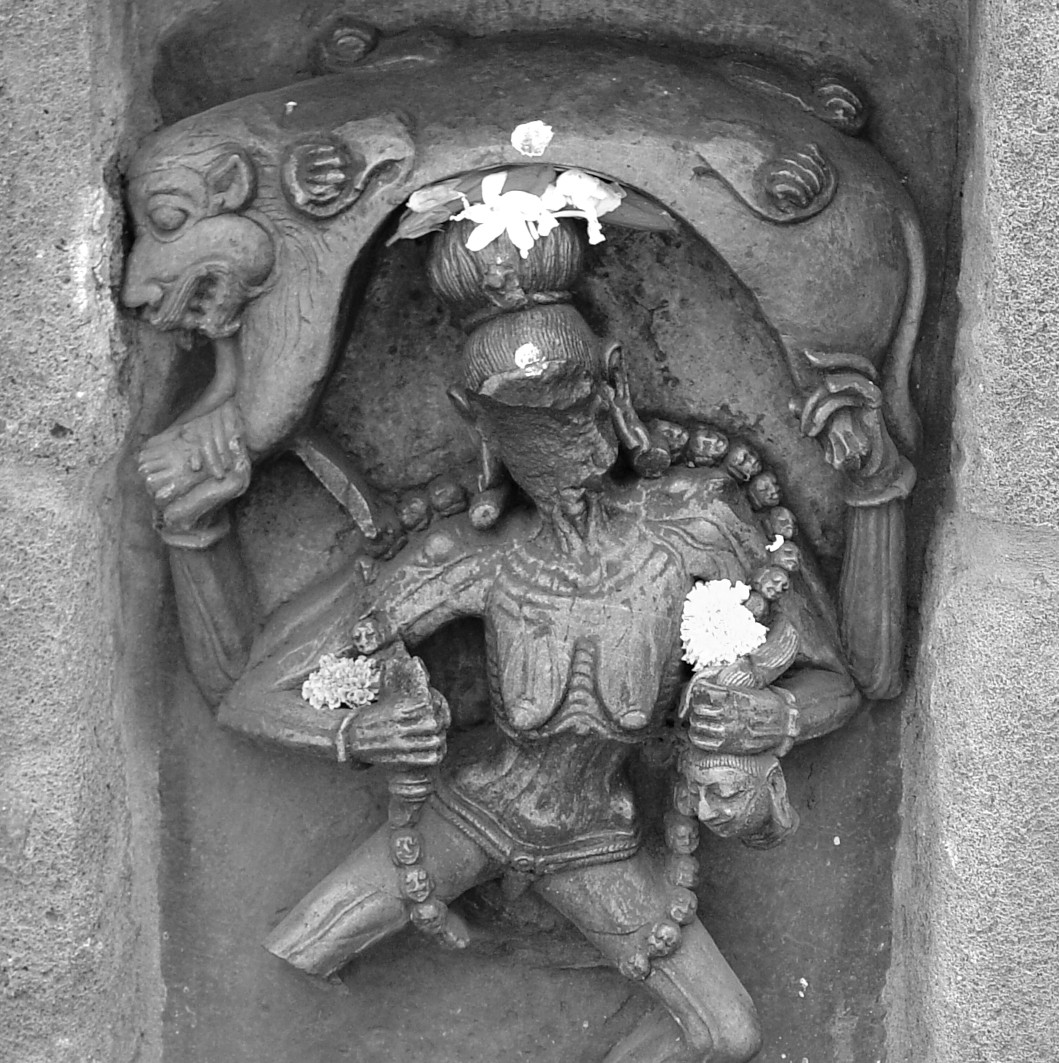Chamunda. Chausath Yogini Temple, Hirapur The goddess of death and decay, dances on a jackal (associated with the cremation grounds), beneath a flayed tiger skin.